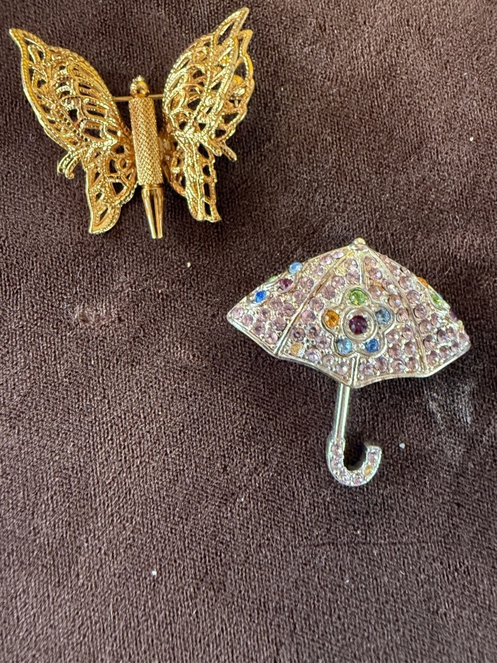 2 VINTAGE MONET BROOCHES. GOLD BUTTERFLY. SILVER UMBRELLO